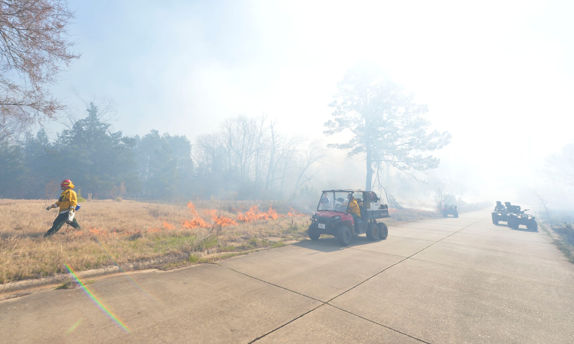 Natural resource technicians from the 2nd Civil Engineer Squadron light a backfire during a controlled burn at Barksdale Air Force Base, La., Feb. 4, 2016. The backfire was used to create a safeguard between the burn perimeter and other wooded areas. By creating a controlled backfire technicians increased the distance embers travel, reducing the chances of spot fires in other areas not scheduled to burn. (U.S. Air Force photo/Airman 1st Class Mozer O. Da Cunha)