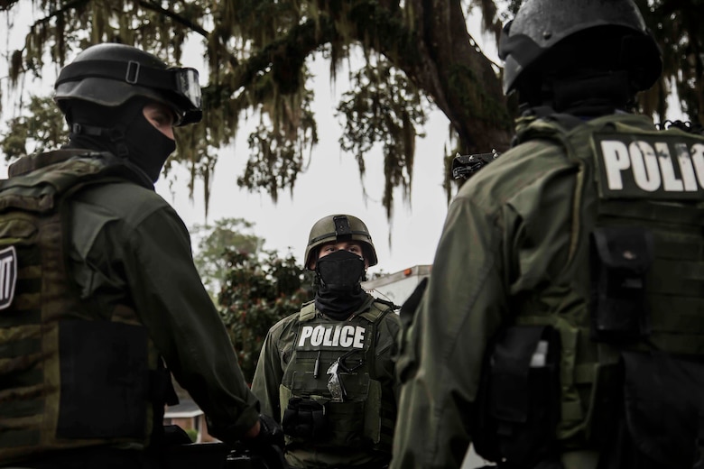 Marines brief prior to conducting crisis negotiation training aboard Laurel Bay Feb. 4. Elements from the Criminal Investigations Division and the Special Reaction Team stationed aboard Marine Corps Air Station Beaufort participated in the exercise. The Marines are with the Provost Marshal’s Office aboard MCAS Beaufort. 