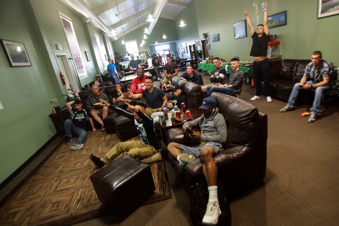 Marines celebrate during the Super Bowl at a Single Marine Program Recreation Center at Camp Pendleton, Feb. 7, 2016. The center hosted a party which included free food and games for noncommissioned officer ranks and below and was an opportunity to meet Marines living in their area. (U.S. Marine Corps photo by Lance Cpl. Caitlin Bevel)
