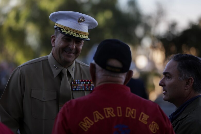 Marine veterans speak with Maj. Gen. Daniel J. O’Donohue, commanding general of the 1st Marine Division, before a Battle Colors Rededication Ceremony in honor of the division’s 75th anniversary, aboard Marine Corps Base Camp Pendleton, Calif., Feb. 4, 2016.  Veteran and active duty Marines and Sailors who served in the division over the years participated in the ceremony, celebrating the oldest, largest, and most decorated division in the Marine Corps. (U.S. Marine Corps photo by Cpl. Will Perkins)