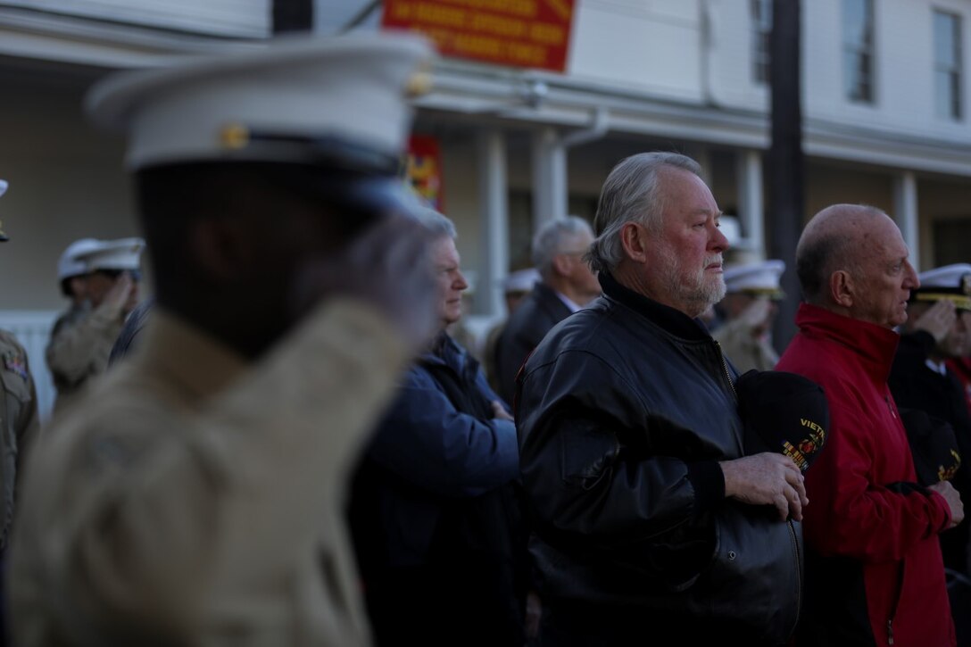 Marines and sailors with 1st Marine Division and the 1st Marine Division Association salute the flag during a Battle Colors Rededication Ceremony in honor of the division’s 75th anniversary, aboard Marine Corps Base Camp Pendleton, Calif., Feb. 4, 2016.  Veteran and active duty Marines and sailors who served in the division over the years participated in the ceremony, celebrating the oldest, largest, and most decorated division in the Marine Corps. (U.S. Marine Corps photo by Cpl. Will Perkins)