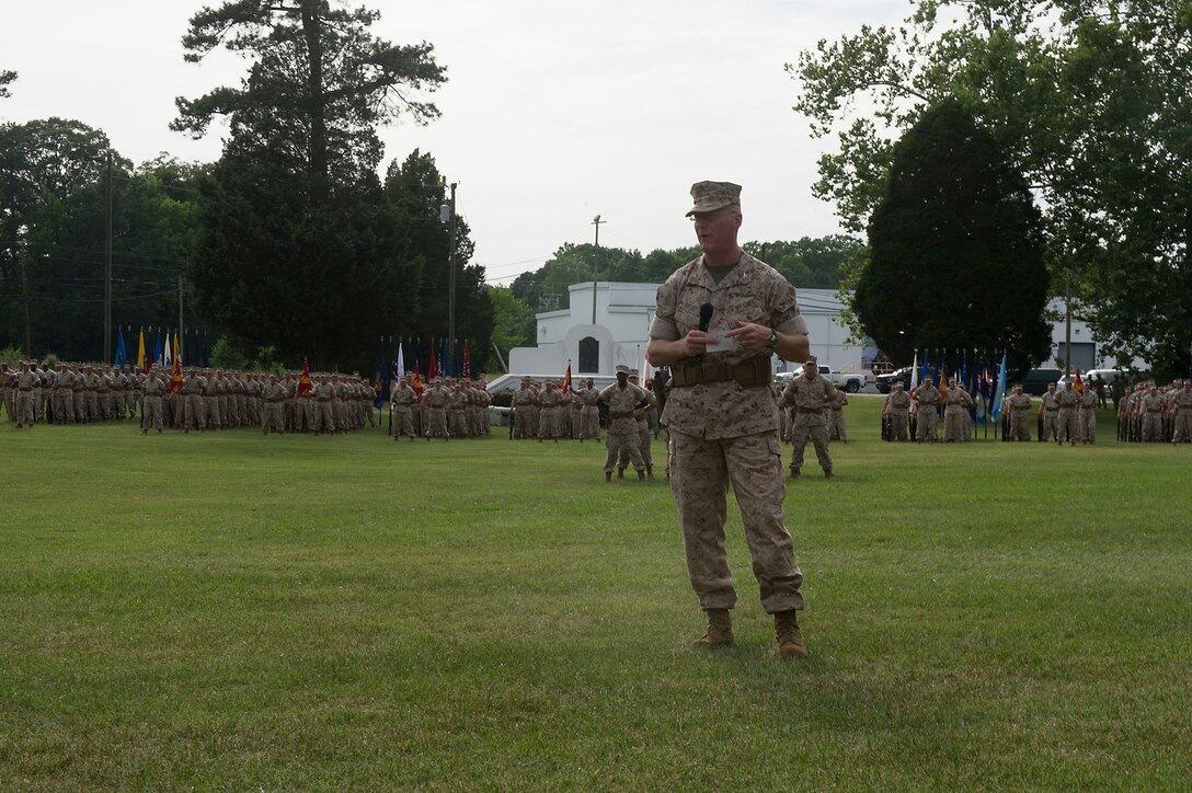 U.S. Marine Col. James M. Bright, outgoing regimental commanding officer of the Marine Corps Security Force, addresses the guests of a change-of-command ceremony June 19 at Naval Weapons Station Yorktown, Va. The Marine Corps Security Force Regiment is the Marine Corps’ largest regiment with over 4,000 Marines and sailors spread across the globe.