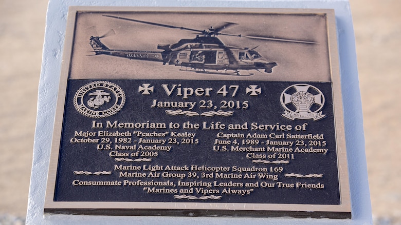 A plaque rests atop a memorial for two pilots with Marine Light Attack Helicopter Squadron 169, who passed away following a mishap last year, at the Strategic Expeditionary Landing Field, at Marine Corps Air Ground Combat Center Twenty nine Palms, Calif. Jan. 23, 2016. Marine Wing Support Squadron 374 completed the memorial in time to be unveiled on the anniversary of the incident. 