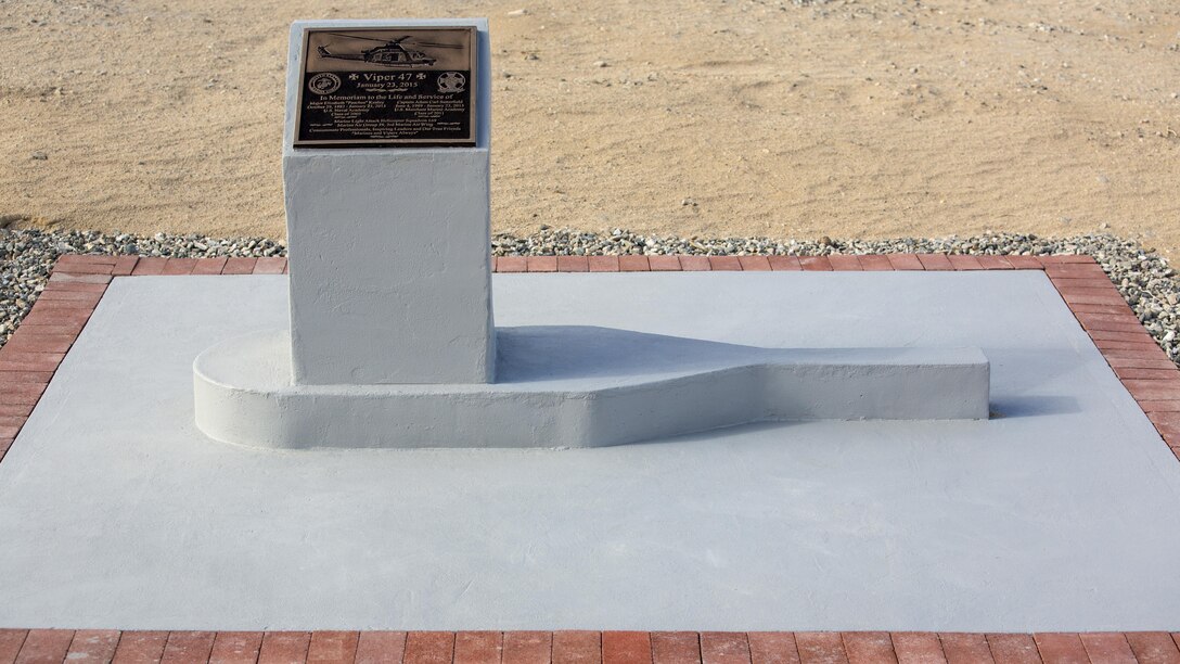 A memorial for two pilots with Marine Light Attack Helicopter Squadron 169, who passed away following a mishap last year, stands at the Strategic Expeditionary Landing Field, at Marine Corps Air Ground Combat Center Twenty nine Palms, Calif. Jan. 23, 2016. Marine Wing Support Squadron 374 completed the memorial in time to be unveiled on the anniversary of the incident. 