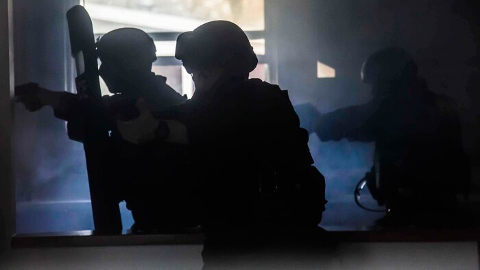 Marines breach a house during hostage scenario training aboard Laurel Bay Feb. 4. Each section had a specific role to play in the field. It is necessary for Marines to train under realistic circumstances should a security threat arise on Laurel Bay. The Marines are with the Provost Marshal’s Office aboard Marine Corps Air Station Beaufort. 