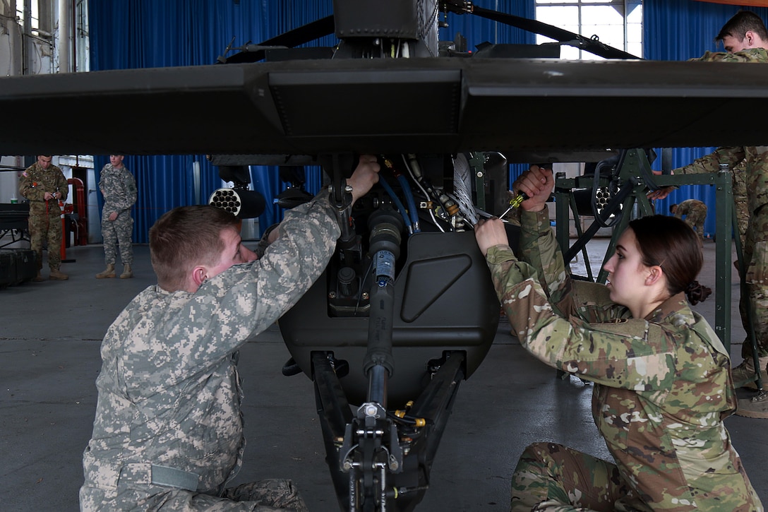 Soldiers prepare an AH-64 Apache helicopter for transport at Fort Bragg, N.C., Feb. 2, 2016. Army photo by Staff Sgt. Christopher Freeman