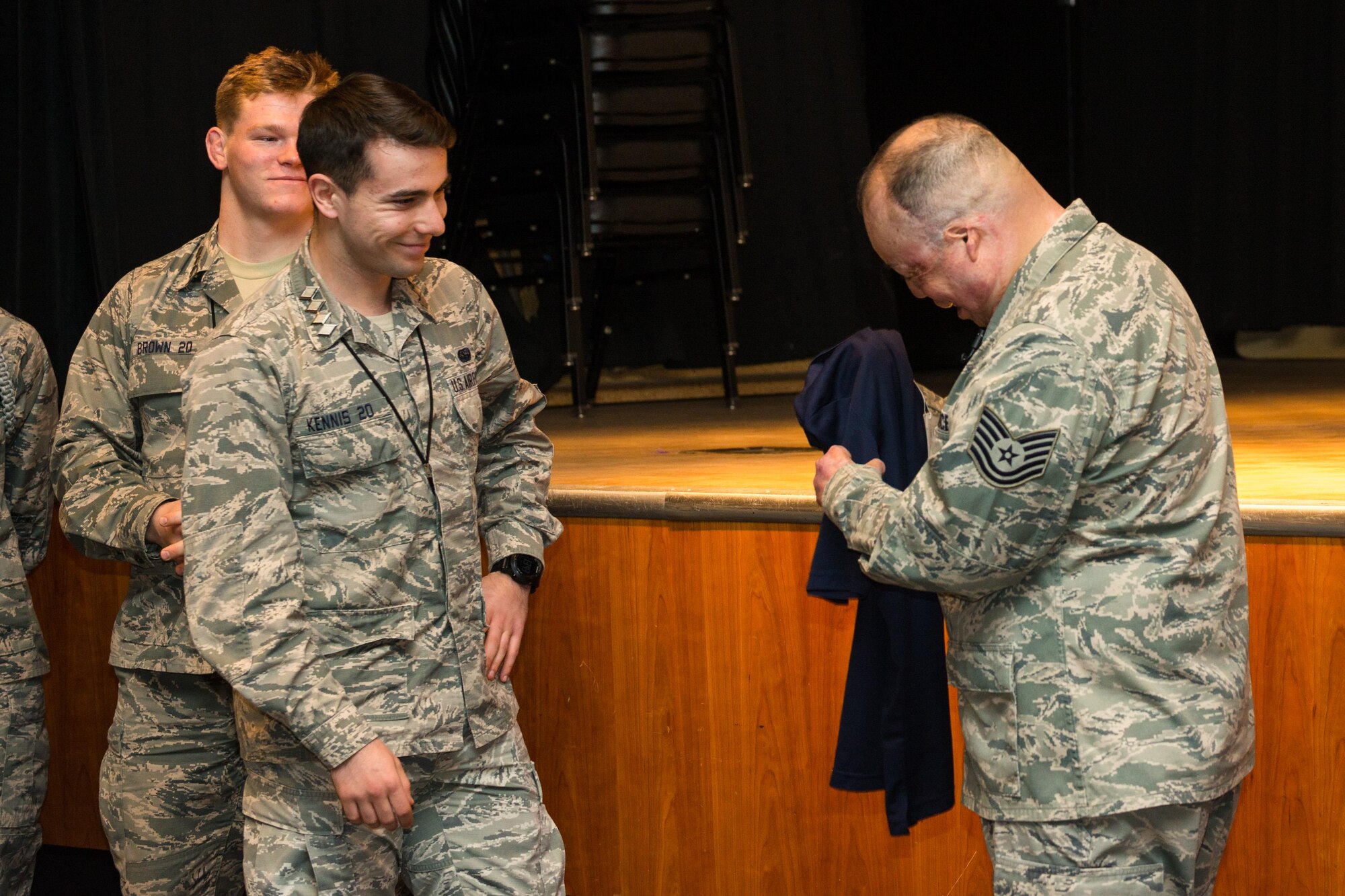 Tech. Sgt. Israel Del Toro is presented with a U.S. Air Force Academy Prep School T-Shirt by Graham Kennis (left), a cadet candidate, after speaking to cadet candidates Feb. 8, 2016, at the Prep School. Del Toro was injured by a roadside bomb in Afghanistan in 2005.  (U.S. Air Force photo/Liz Copan)