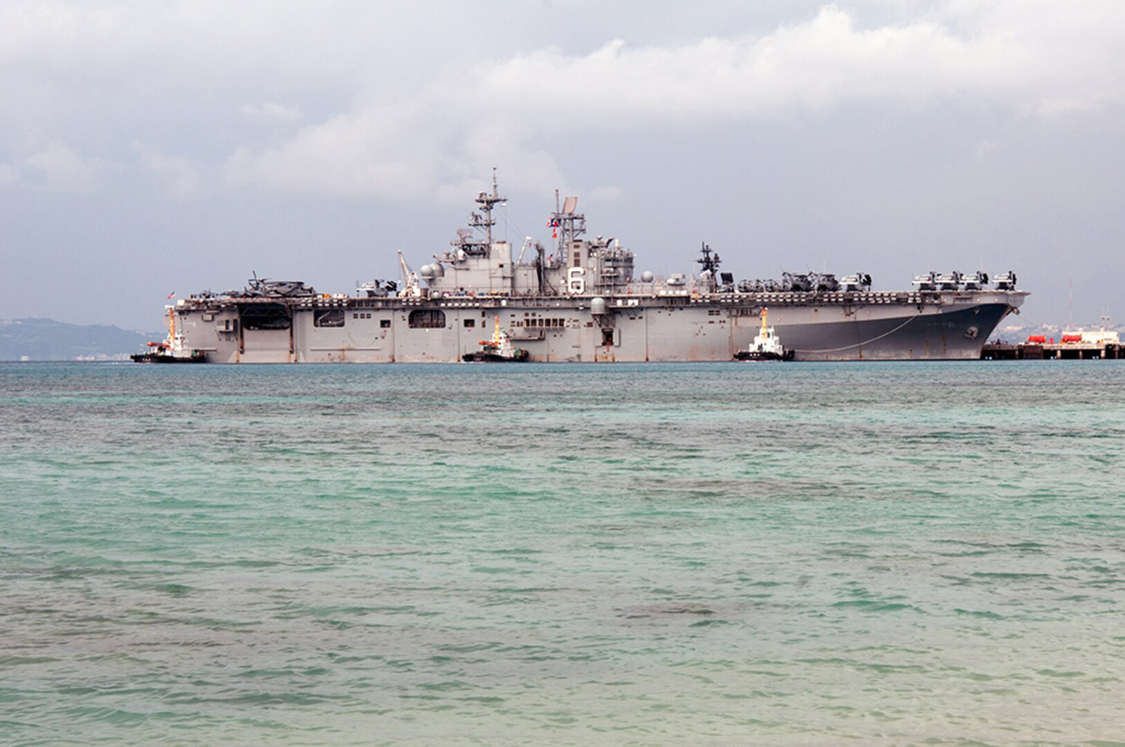 Okinawa, JAPAN (Feb. 6, 2016) Amphibious assault ship USS Bonhomme Richard (LHD 6) departs White Beach Naval Facility after embarking Marines assigned to the 31st Marine Expeditionary Unit (31st MEU). Bonhomme Richard, flagship of the Bonhomme Richard Amphibious Ready Group (ARG) with embarked Amphibious Squadron (PHIBRON) 11 and the 31st MEU are on deployment to the U.S. 7th Fleet area of operations supporting security and stability in the Indo-Asia-Pacific region. 