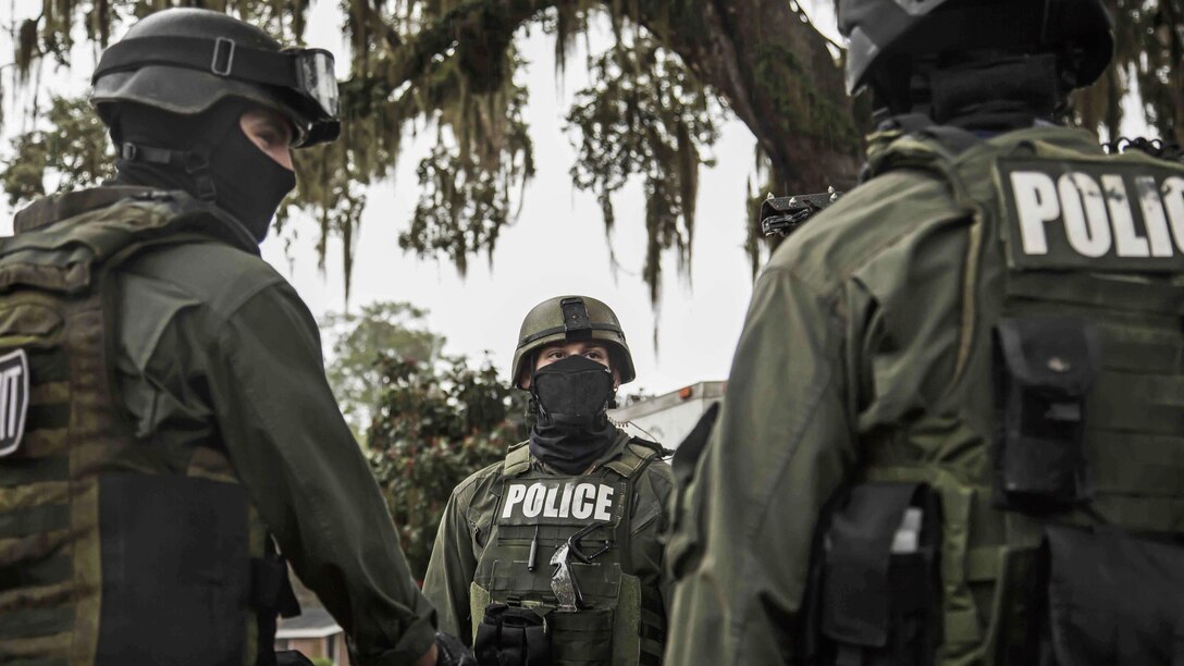 Marines brief prior to conducting a hostage scenario training at Laurel Bay Feb. 4, 2016. Elements from the Criminal Investigations Division and the Special Reaction Team stationed aboard Marine Corps Air Station Beaufort participated in the exercise. The Marines are with the Provost Marshal’s Office aboard MCAS Beaufort.