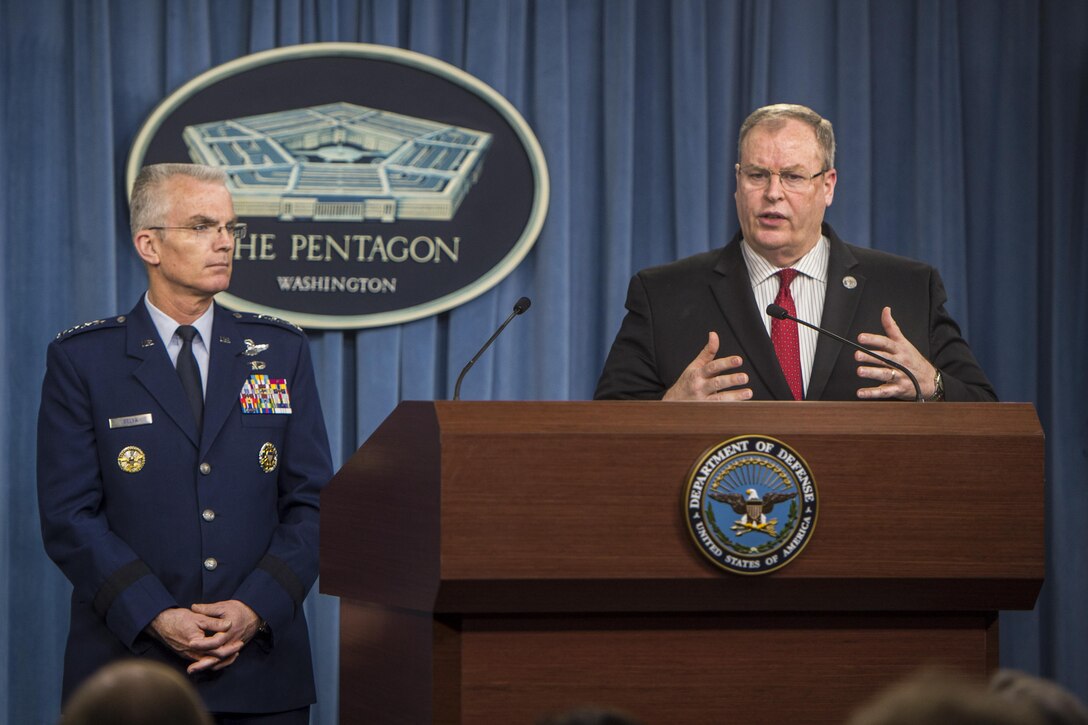 Deputy Defense Secretary Bob Work announces details of the Defense Department's fiscal year 2017 budget proposal as Air For Gen. Paul J. Selva, vice chairman of the Joint Chiefs of Staff, looks on during a press briefing at the Pentagon, Feb. 9, 2016. DoD photo by Navy Petty Officer 1st Class Tim D. Godbee