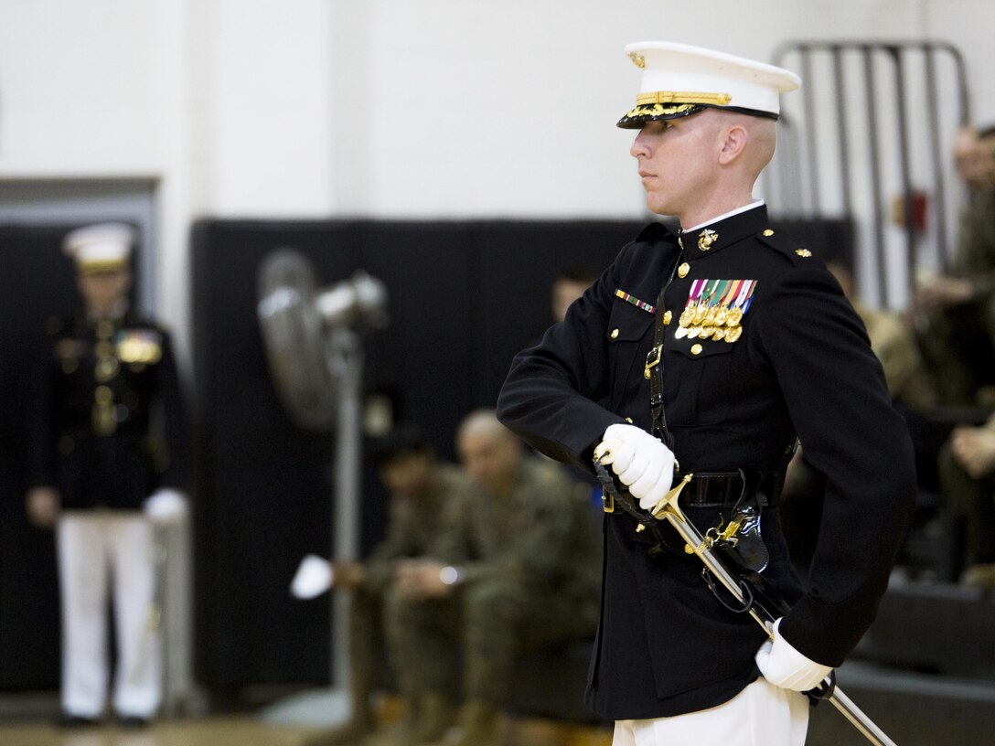 Maj. Paul Steketee, adjutant, Headquarters and Service Company, draws sword during the 2016 parade staff tryouts at Marine Barracks Washington, D.C., Feb. 9, 2016. The evaluation selects the most qualified Marines of “the Oldest Post of the Corps” for this year’s upcoming parade season as well as assignments for ceremonies and other related events. (Official Marine Corps photo by Cpl. Chi Nguyen/Released)