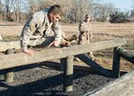 Pfc. Marcial Ortiz, Chilean navy, competes in the obstacle course portion of the Texas Military Department's 2016 Best Warrior Competition at Camp Swift in Bastrop, Texas, Feb. 6, 2016. Traditionally a joint competition with competitors from the Texas Army and Air National Guards, this year's event invited service members from the U.S. Army Reserves component and the Chilean military to compete in the three-day grueling competition, testing the aptitude of each competitor in several mentally and physically challenging events relevant in today's operational environment. 