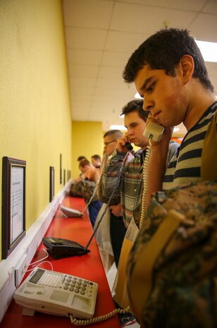 Recruits of Kilo Company, 3rd Recruit Training Battalion, make their phone calls home, reading only what is printed on the script in front of them, during receiving at Marine Corps Recruit Depot San Diego, Feb. 8. Recruits will not be able to make another phone call until the end of recruit training. Annually, more than 17,000 males recruited from the Western Recruiting Region are trained at MCRD San Diego. Kilo Company is scheduled to graduate May 6.