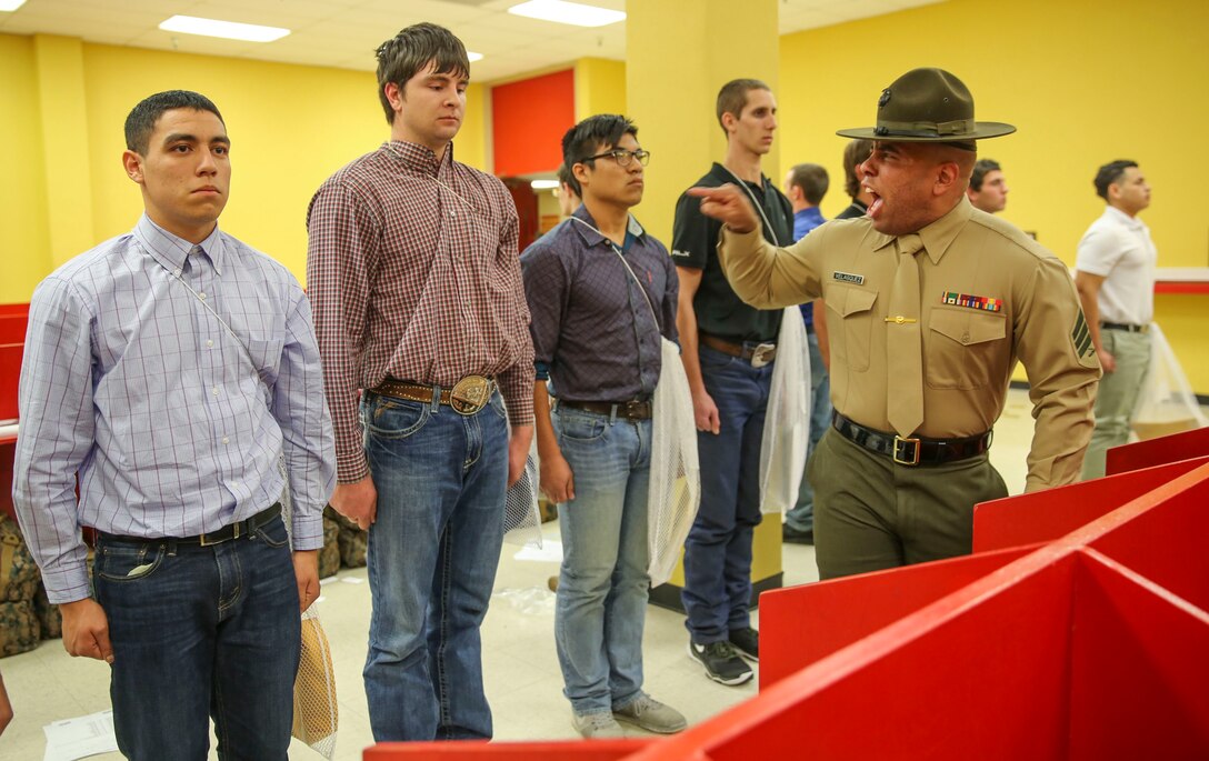 Sergeant Lewis A. Velasquez, drill instructor, Receiving Company, Support Battalion, corrects a recruit for not following directions during receiving at Marine Corps Recruit Depot San Diego, Feb. 8. Although recruits are confused and disoriented during this portion of training, the chaos serves a purpose during the transformation from civilian to Marine. Annually, more than 17,000 males recruited from the Western Recruiting Region are trained at MCRD San Diego. Kilo Company is scheduled to graduate May 6.