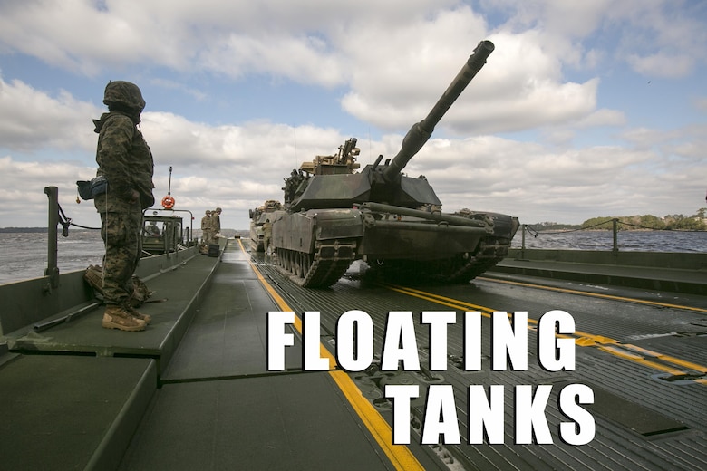 Marines with Bridge Company, 8th Engineer Support Battalion, prepare to unload two M1A1 Abrams tanks following their transport across New River by using a seven-bay raft system during a water-crossing operation at Camp Lejeune, N.C., Feb. 4, 2016. The unit boasts a wide range of raft systems and bridging that it is able to do to allow tactical vehicles to cross large bodies of water. (U.S. Marine Corps photo by Lance Cpl. Damarko Bones/Released)