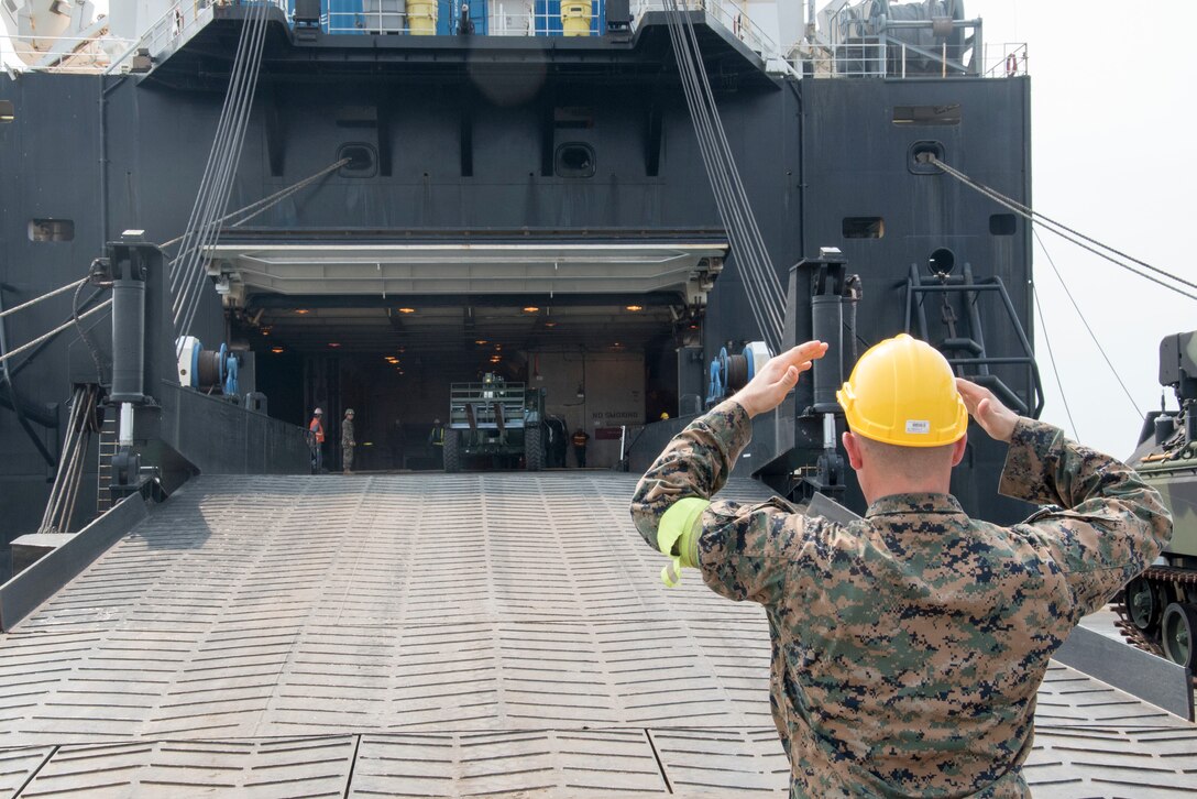 160202-N-OU129-044 LAEM CHABANG (Feb. 2, 2016) Civilian mariners and Marine Corps personnel unload Military Sealift Command's Marine Prepositioning Force ship USNS 1st Lt. Jack Lummus (T-AK 3011) at the port of Laem Chabang, Thailand, Feb. 2, in support of exercise Cobra Gold 2016. Exercise Cobra Gold 2016 is one of the largest multinational exercises in the Asia-Pacific region. 