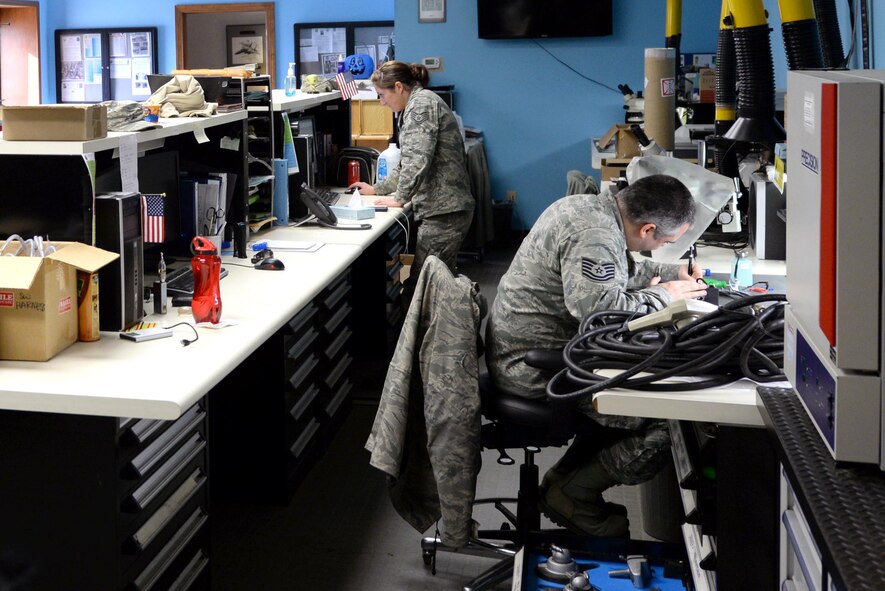 Staff Sgt. Malia Ortiz (left) and Tech. Sgt. Darrel Rhodes (right), 4th Maintenance Group Air Force Repair Enhancement Program technicians, prepare fixed products for re-distribution, Feb. 5, 2016, at Seymour Johnson, Air Force Base North Carolina. Beginning in the mid-90s, AFREP repairs base owned products the AF deems broken or cracked and is now located at almost every Air Force base. (U.S. Air Force photo/ Airman 1st Class Ashley Williamson)