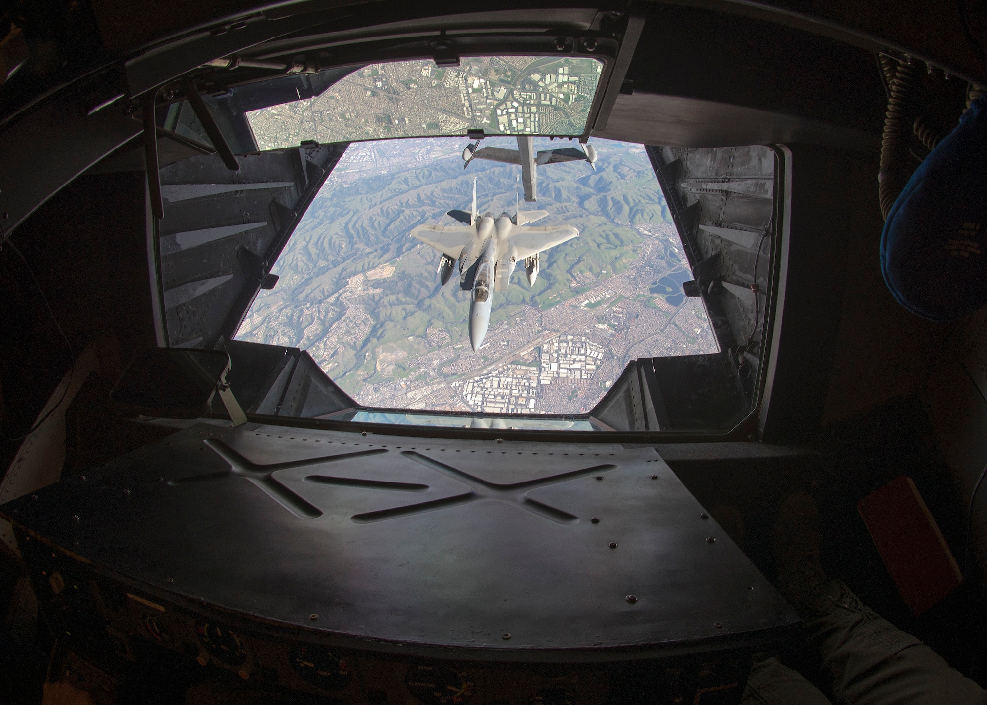 An F-15 Eagle assigned to the California Air National Guard, is refueled by a KC-10 Extender assigned to Travis Air Force Base, California, during a mission supporting Operation Noble Eagle Feb. 7, 2016. The refueling mission was in direct support of fighter aircraft patrolling the airspace surrounding Super Bowl 50 in Santa Clara, California. Operation Noble Eagle is the name given to the military response to the type of terrorist attacks used on Sept. 11, 2001. Those attacks prompted NORAD to augment its mission to begin conducting surveillance and control of the aerospace inside Canada and the United States (U.S. Air Force photo by T.C. Perkins Jr.)