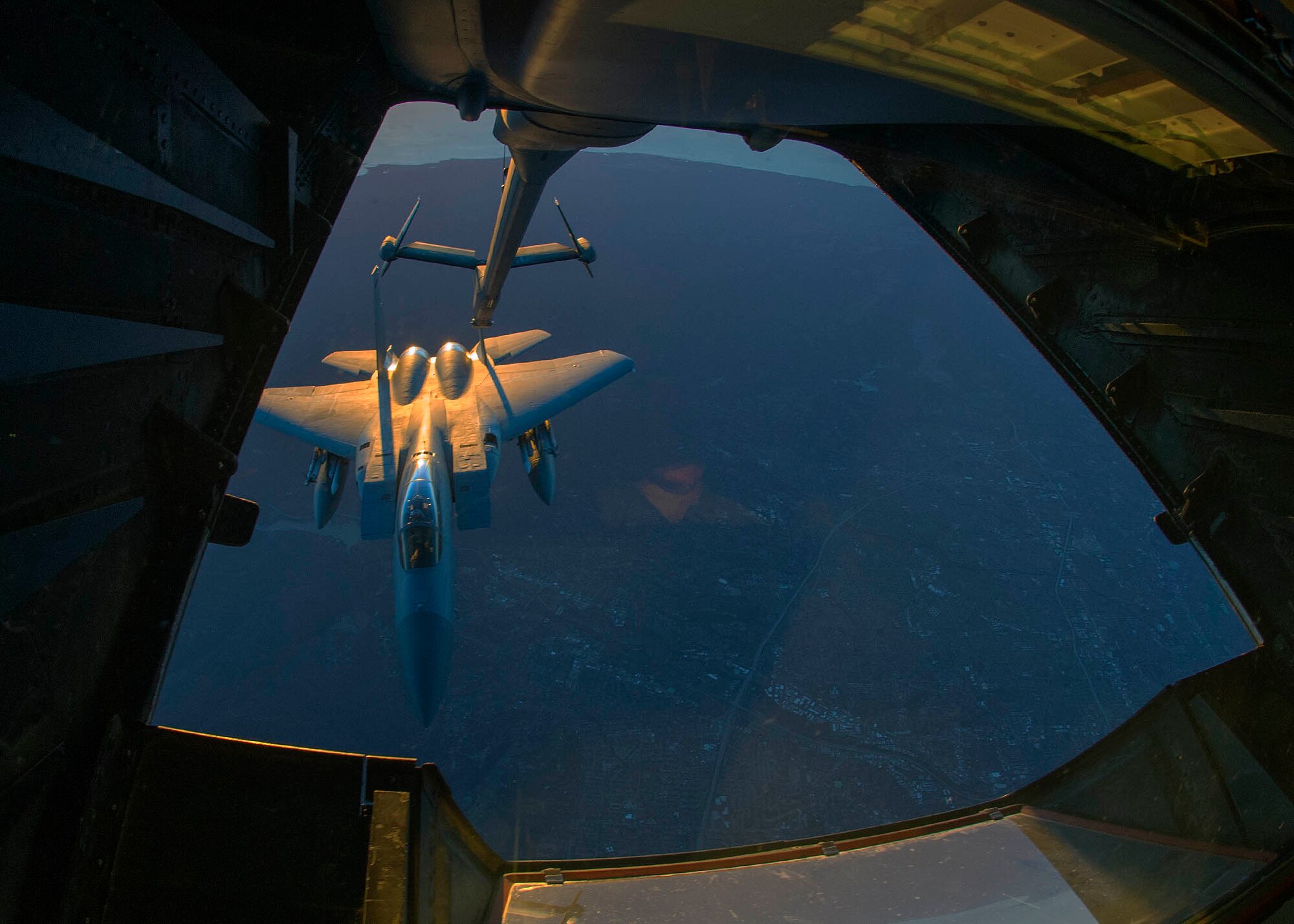 An F-15 Eagle assigned to the California Air National Guard is refueled by a KC-10 Extender assigned to Travis Air Force Base, California, Feb. 7, 2016 during a mission supporting Operation Noble Eagle. The refueling mission was in direct support of fighter aircraft patrolling the airspace surrounding Super Bowl 50 in Santa Clara, California. Headed by NORAD, Operation Noble Eagle is the name given to the military response to the type of terrorist attacks used on Sept. 11, 2001. Those attacks prompted NORAD to augment its mission to begin conducting surveillance and control of the aerospace inside Canada and the United States (U.S. Air Force photo by T.C. Perkins Jr.)