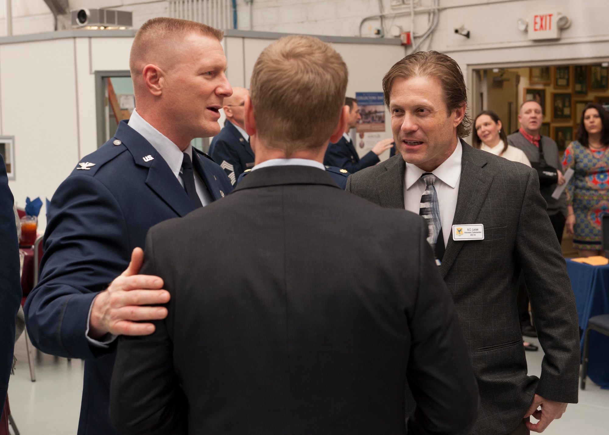 Col. Michael Grismer, 436th Airlift Wing commander, speaks with Andrew Johnson, Dentsply International’s LD Caulk Division director of operations, and A.C. Lucas, Fordham and Old Dominion Brewing Company production planning and material procurement, during the 2016 Team Dover Honorary Commanders induction ceremony Feb. 6, 2016, at the Air Mobility Command Museum on Dover Air Force Base, Del. Lucas was inducted into the Team Dover Honorary Commander Alumni Association, while Johnson became the 436th AW honorary command chief. (U.S. Air Force photo/Senior Airman Zachary Cacicia) 