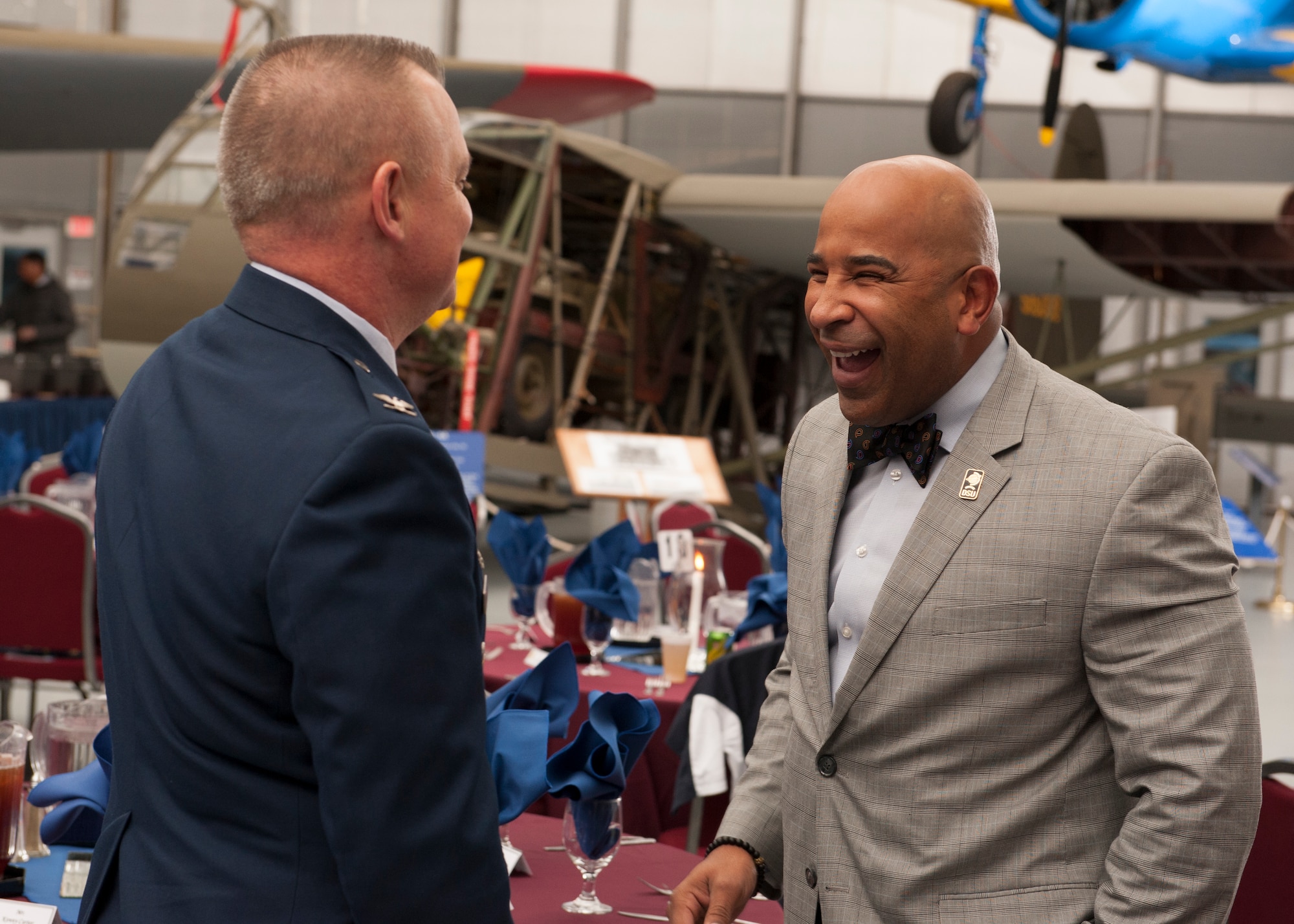 Col. D. Scott Durham, 512th Airlift Wing commander, speaks with Kenny Carter, Delaware State University head football coach, during the 2016 Team Dover Honorary Commanders induction ceremony Feb. 6, 2016, at the Air Mobility Command Museum on Dover Air Force Base, Del. Carter will serve as the 512th Maintenance Squadron’s honorary commander. (U.S. Air Force photo/Senior Airman Zachary Cacicia)