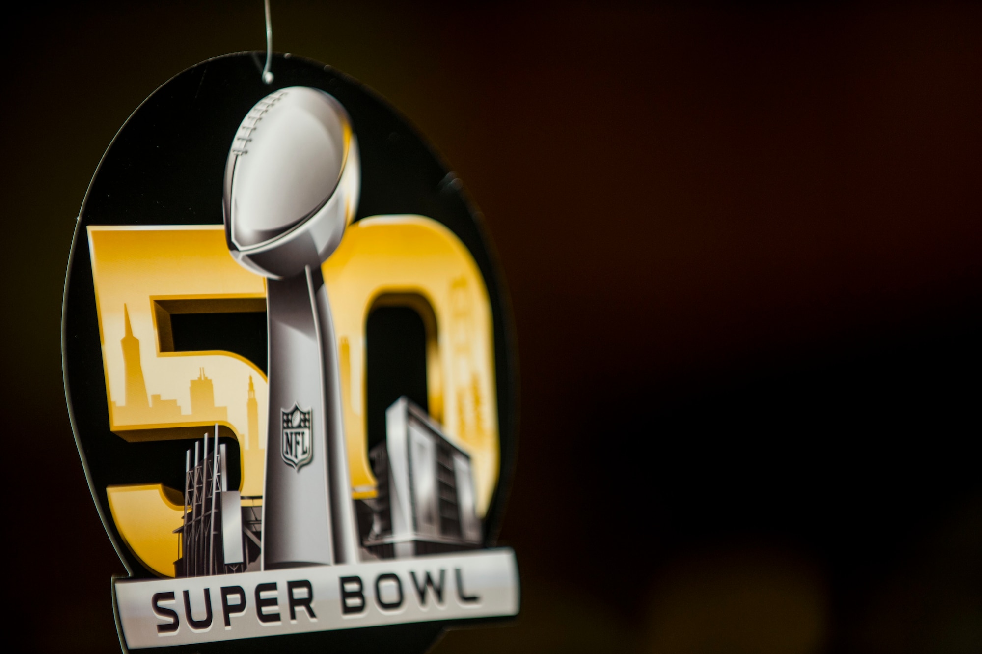 A decoration for the National Football League’s 50th Super Bowl hangs during the game’s screening in Club Eifel at Spangdhalem Air Base, Germany, Feb. 8, 2016. The game took place at Levi’s Stadium in Santa Clara, Ca. (U.S. Air Force photo by Airman 1st Class Timothy Kim/Released)
