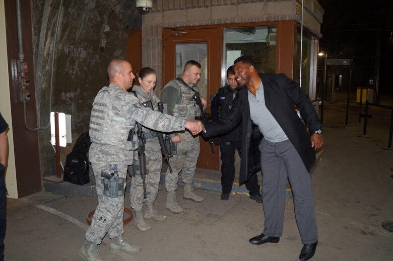 CHEYENNE MOUNTAIN AIR FORCE STATION, Colo. – Former NFL player Herschel Walker greets members of the 721st Security Forces Squadron during a visit to Cheyenne Mountain Air Force Station on Feb. 1, 2016. Walker was able to visit mission essential personnel despite base closures due to severe weather. His presentation about resilience was cancelled due to weather, but may be rescheduled for the spring. (courtesy photo)