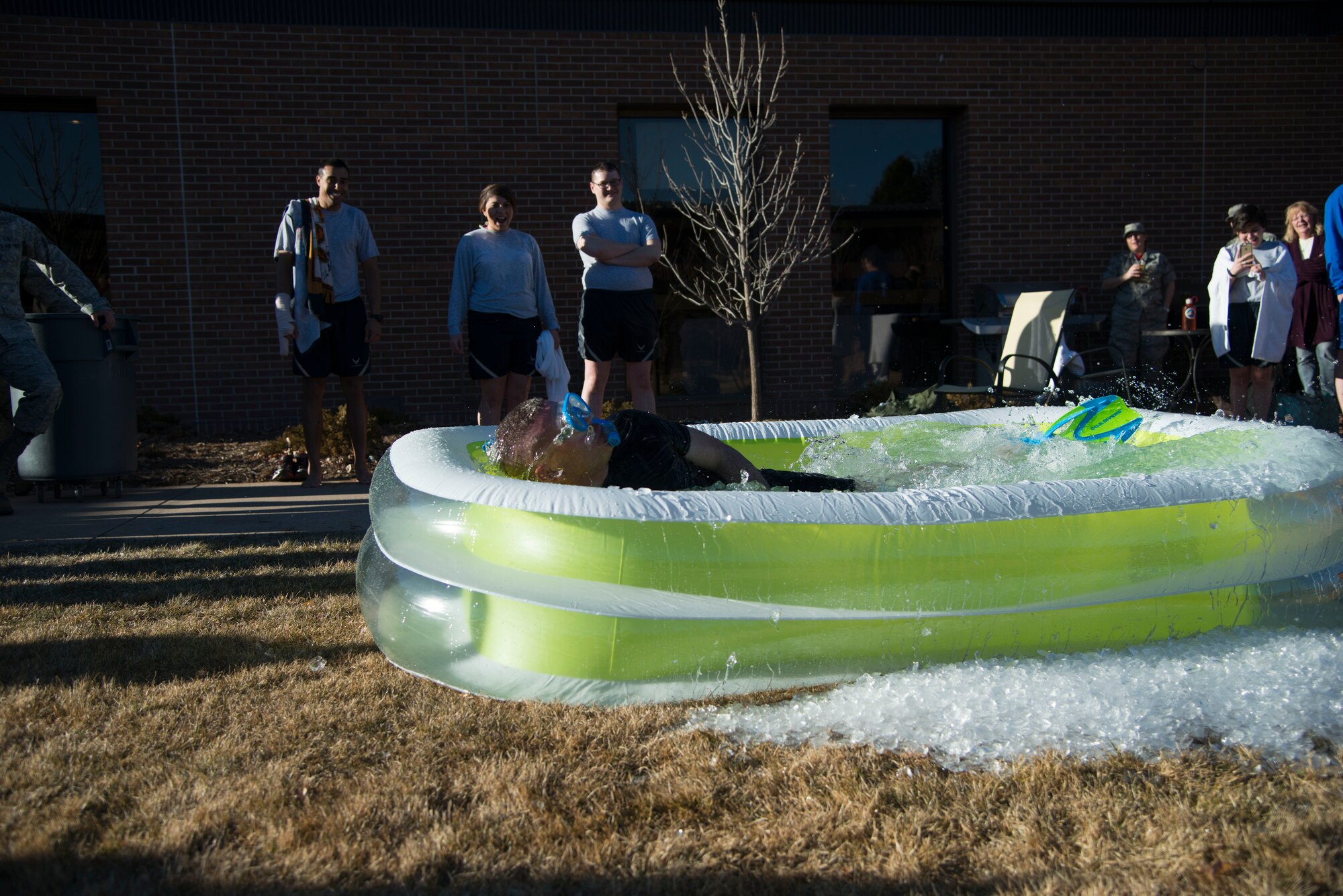 PETERSON AIR FORCE BASE, Colo. – Col. Eric Dorminey, 21st Space Wing vice commander, surfaces as the clock starts for his turn in the ice-cold water during the January Final Friday Polar Ice Challenge on Jan. 29, 2016 at the Peterson Club. Dorminey was the last of the participants who braved the chilled water for the required eight seconds. January’s Final Friday was themed the Thule Experience and included 11 participants braving the pool. (U.S. Air Force photo by Tech. Sgt. Jared Marquis) 