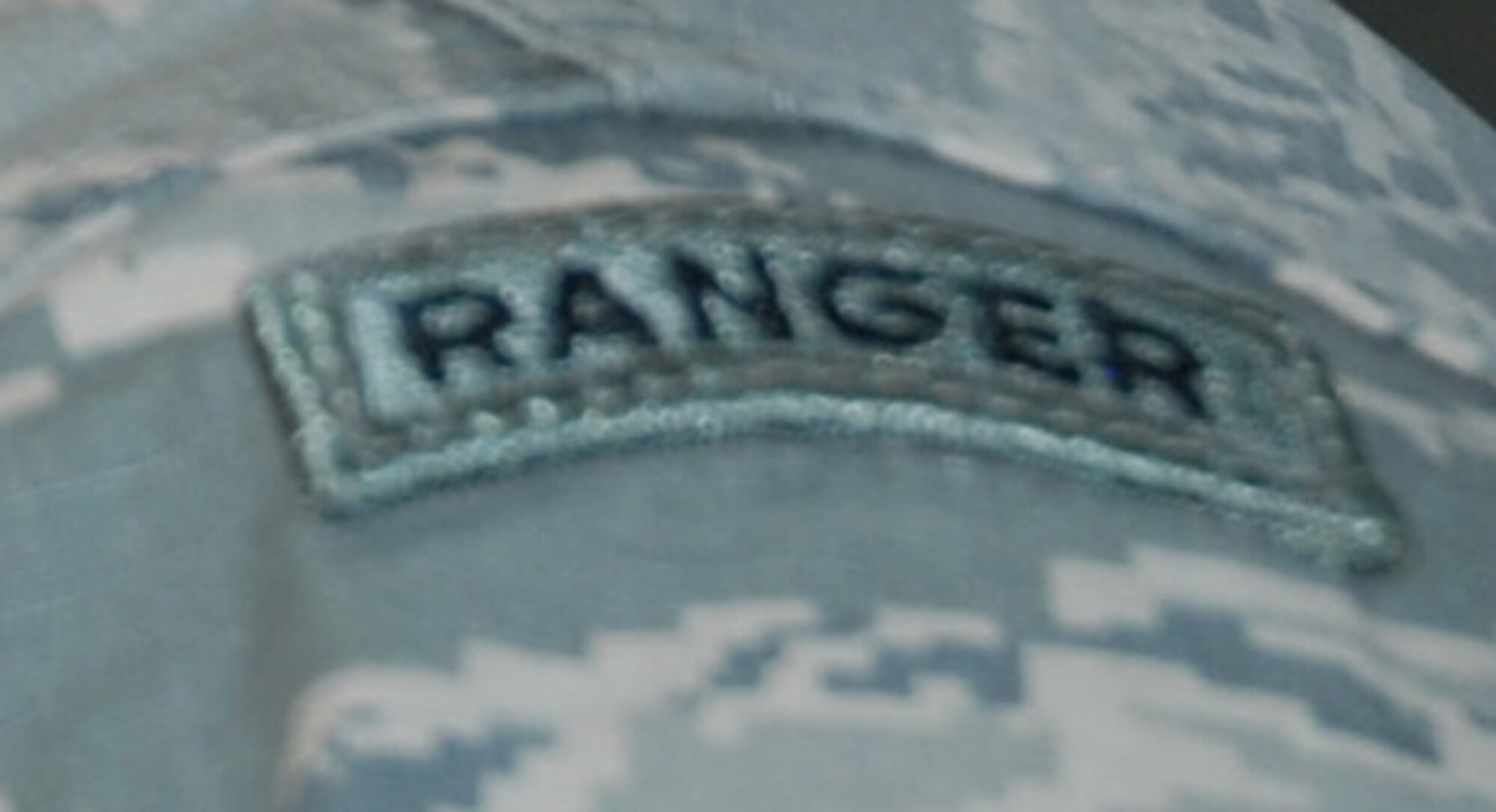 FORT CARSON, Colo. -- Senior Airman Aaron Inch, 13th Air Support Operations Squadron stationed at Fort Carson, Colo. wears his Ranger tab with pride. Inch graduated from the elite Army Ranger School on Dec. 4. The school helped him be better prepared as a small group leader and also for becoming a Joint Terminal Attack Controller in the future. (U.S. Air Force photo by Dave Smith)