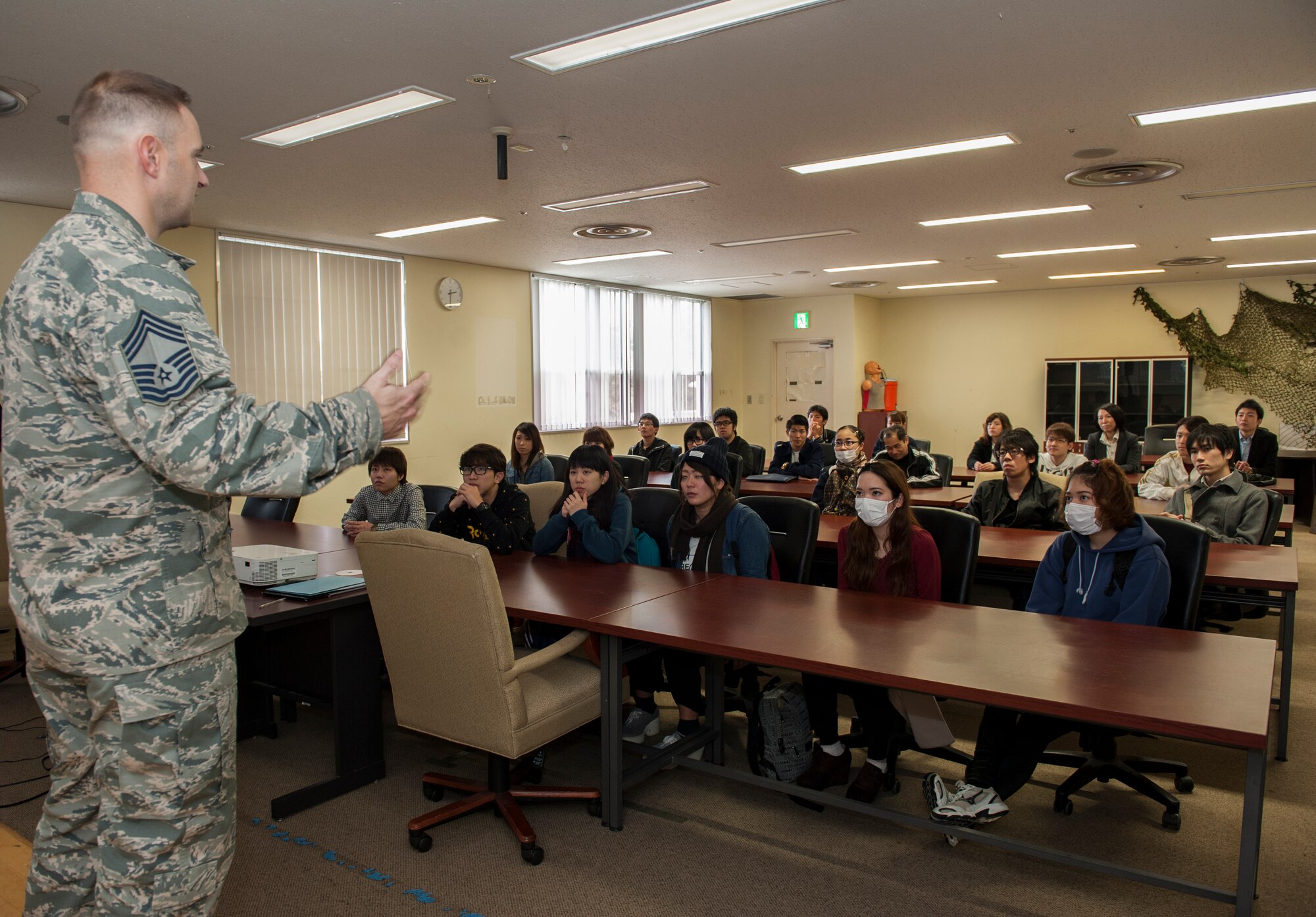 U.S. Air Force Chief Master Sgt. Jamie Auger, 18th Security Forces Squadron security forces manager, speaks to Okinawa International University students Feb. 5, 2016, at Kadena Air Base, Japan. Auger discussed how important a college education is to ensuring their success. The Okinawa International University students were also briefed about the purpose of Kadena’s presence on the island of Okinawa and the importance of the partnership between Kadena and Japan. (U.S. Air Force photo by Airman 1st Class Lynette M. Rolen)