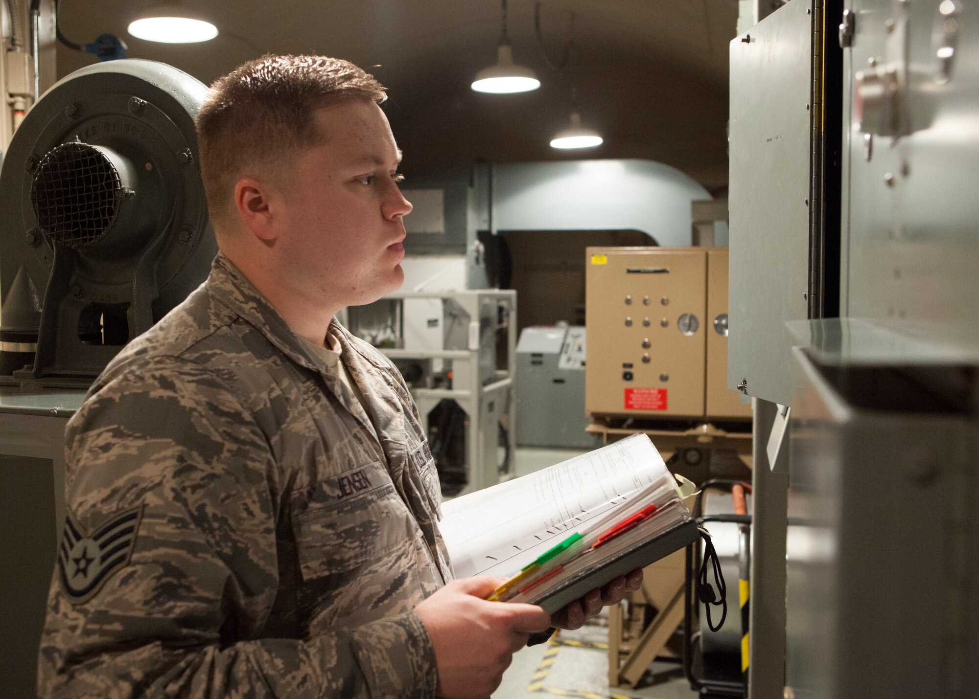 Staff Sgt. Jerimiah Jensen, 320th Missile Squadron facility manager, conducts a routine maintenance check in the launch control equipment building of a missile alert facility belonging to F.E. Warren Air Force Base, Jan. 28, 2016. Facility managers keep missile alert facilities in operation order for the nuclear deterrent mission. (U.S. Air Force photo by Lan Kim)