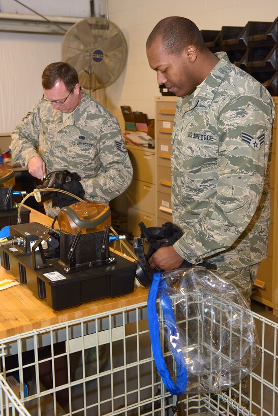 Ohio Air National Guard Staff Sgt. Robert Kalp, left, and Senior Airman Burton Cooper III, 178th Logistics Readiness Squadron perform gas mask evaluations at Springfield Air National Guard Base Feb. 5, 2016. Kalp and Cooper performed the evaluations as part of their unit training assembly duties. (Ohio Air National Guard photo by Master Sgt. Seth Skidmore/Released)