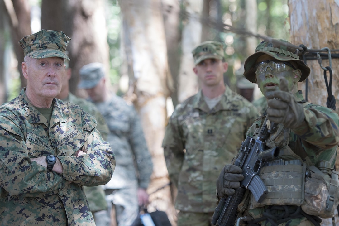 Marine Gen. Joseph F. Dunford Jr., chairman of the Joint Chiefs of Staff, speaks with an instructor at the 25th Infantry Division's Tropic Lightning Academy and Jungle Operations Training Center in Hawaii, Feb. 9th, 2016. The  JOTC trains soldiers on survival, communication, navigation, waterborne and patrol base operations, in a jungle environment. DoD Photo by Navy Petty Officer 2nd Class Dominique A. Pineiro
