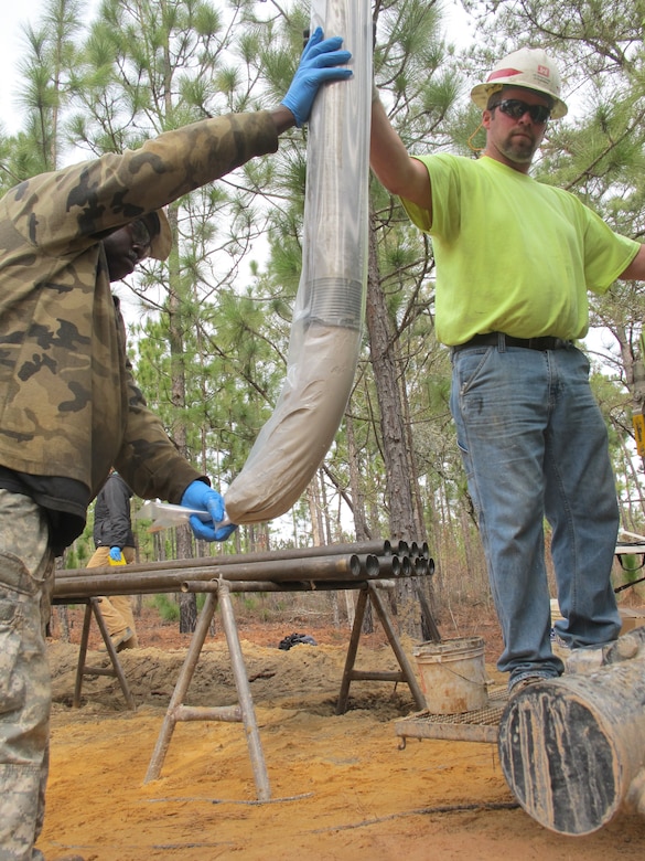 Drill Rig Assistant Lemon Moses (left) and Drill Operator John Verrett (right) bag soil samples during groundwater investigations near Fort Jackson, South Carolina Jan. 26. Soil was extracted using the TerraSonic drill rig—a piece of high-tech machinery that is the only one of its kind within USACE. The drill can be used to perform subsurface and geotechnical investigation projects on the toughest terrains throughout the nation.