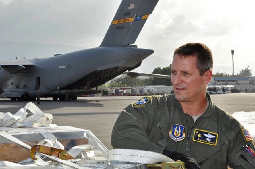 Master Sgt. Ken Hundemer, 317th Airlift Squadron loadmaster, unloads humanitarian aid from a C-17 Globemaster III while in Port Au Prince, Haiti.