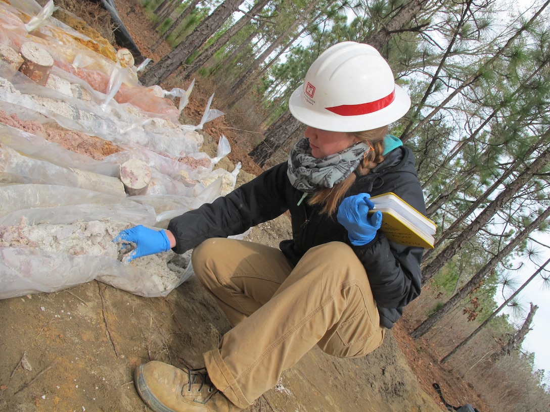 Meghan Riehl, a Savannah Corps geologist, inspects soil samples during groundwater investigations near Fort Jackson, South Carolina Jan. 26. Soil was extracted using the TerraSonic drill rig—a piece of high-tech machinery that is the only one of its kind within USACE. The drill can be used to perform subsurface and geotechnical investigation projects on the toughest terrains throughout the nation.