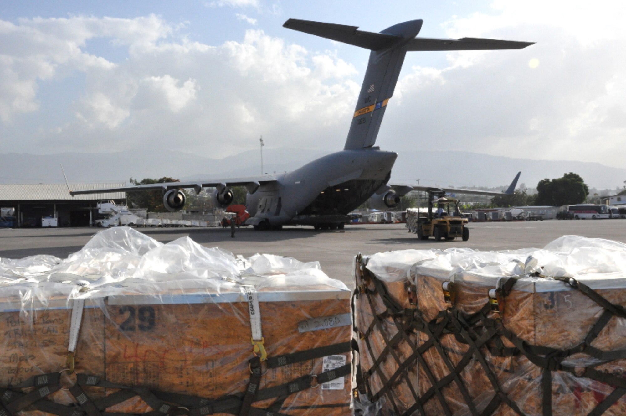 Humanitarian aid is unloaded from a Joint Base Charleston, S.C. C-17 Globemaster III in Port Au Prince Haiti. (U.S. Air Force photo by Maj. Wayne Capps)