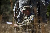 Sgt. Joseph Oneto, a military police with the 724th Military Police Detainee Operations Battalion, from Naples, Fla., orients his map before plotting points during a land navigation event at Camp Blanding, Florida, Feb. 9. The land navigation event is part of this year's 200th Military Police Command's Best Warrior Competition. The winning noncommissioned officer and junior enlisted Soldiers will move on the U.S. Army Reserve Command competition in May. (U.S. Army Photo by Sgt. Audrey Ann Hayes)