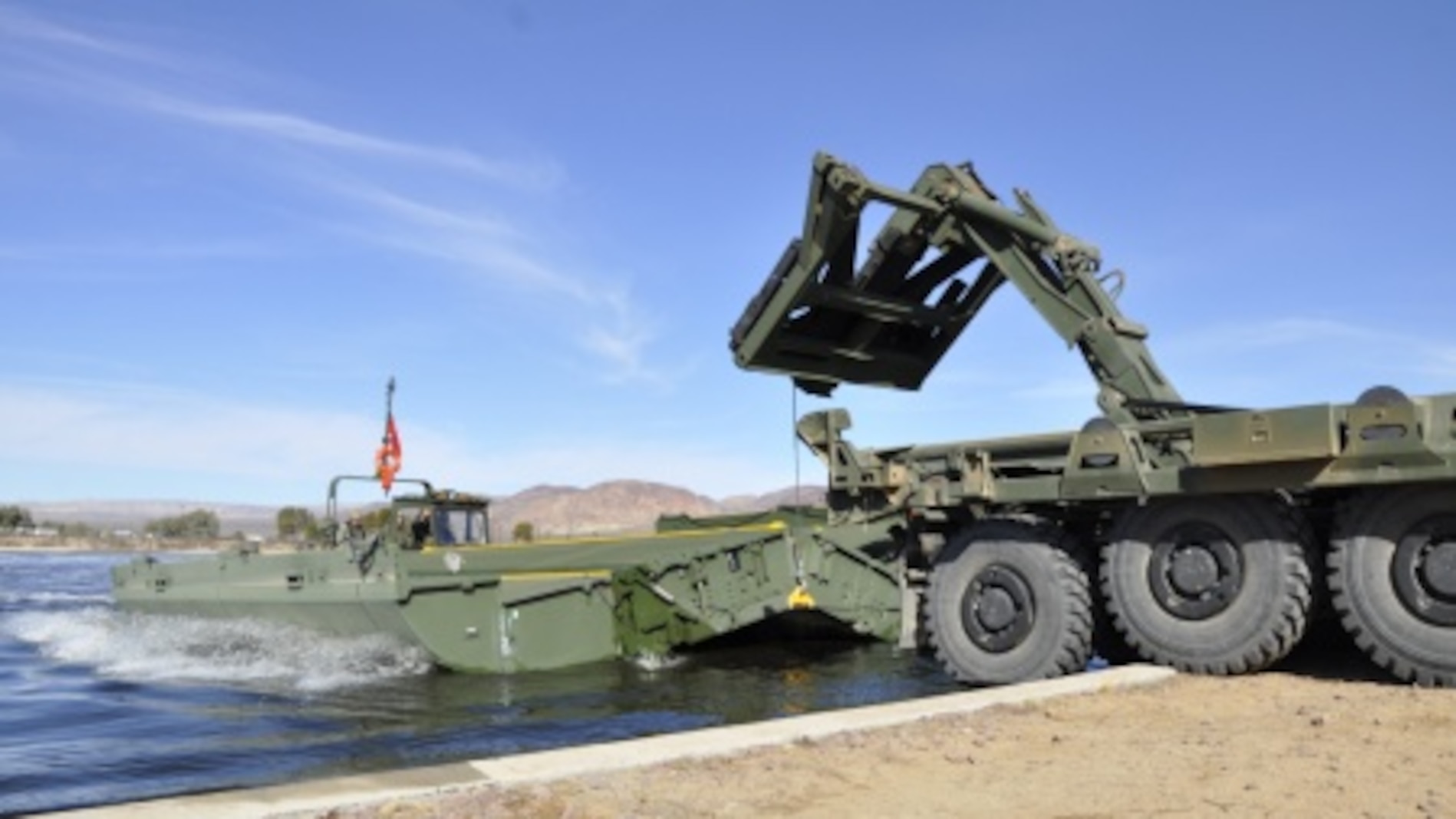 Marines with 7th Engineer Support Battalion from Marine Corps Base Camp Pendleton, Calif., test Improved Ribbon Bridge components with representatives from Marine Corps Systems Command, and Marine Corps Engineer School, at Production Plant Barstow's test pond aboard Marine Corps Logistics Base Barstow’s Yermo Annex, Calif., Jan. 25.
