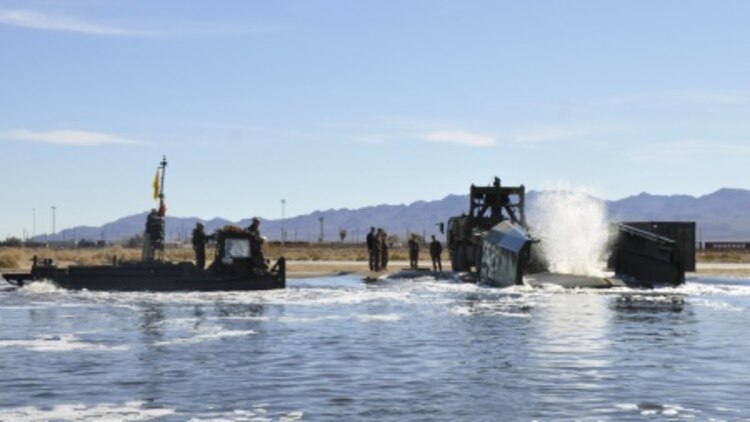 Marines with 7th Engineer Support Battalion from Marine Corps Base Camp Pendleton, Calif., test Improved Ribbon Bridge components with representatives from Marine Corps Systems Command, and Marine Corps Engineer School, at Production Plant Barstow's test pond aboard Marine Corps Logistics Base Barstow’s Yermo Annex, Calif., Jan. 25.

