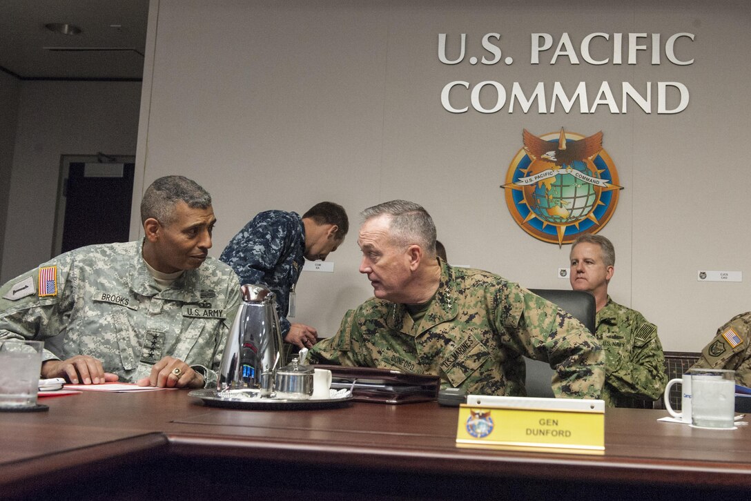 Marine Gen. Joseph F. Dunford Jr., chairman of the Joint Chiefs of Staff, speaks with Army Gen. Vincent K. Brooks, commanding general of U.S. Army Pacific, during a U.S. Pacific Command round-table discussion at the command's headquarters on Camp H.M. Smith, Hawaii, Feb. 9, 2016. DoD Photo by Navy Petty Officer 2nd Class Dominique A. Pineiro
