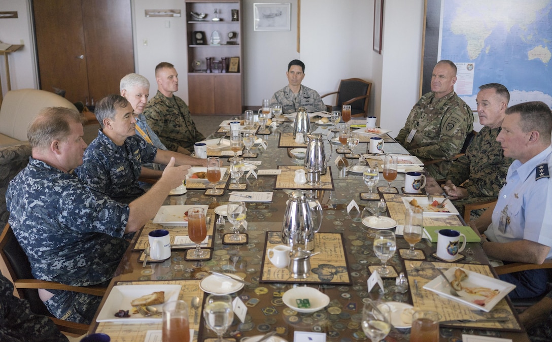 Navy Rear Adm. Mark C. Montgomery speaks to Marine Gen. Joseph F. Dunford Jr., right center, chairman of the Joint Chiefs of Staff, during a working lunch at U.S. Pacific Command Headquarters on Camp H.M. Smith, Hawaii, Feb. 9, 2016. DoD Photo by Navy Petty Officer 2nd Class Dominique A. Pineiro