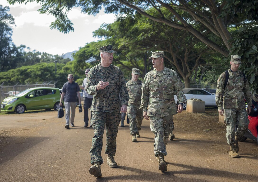Marine Gen. Joseph F. Dunford Jr., chairman of the Joint Chiefs of Staff, speaks with Army Maj. Gen. Charles A. Flynn, commander of the 25th Infantry Division, during a tour of an exercise site on  Schofield Barracks, Hawaii, Feb. 9, 2016. DoD Photo by Navy Petty Officer 2nd Class Dominique A. Pineiro