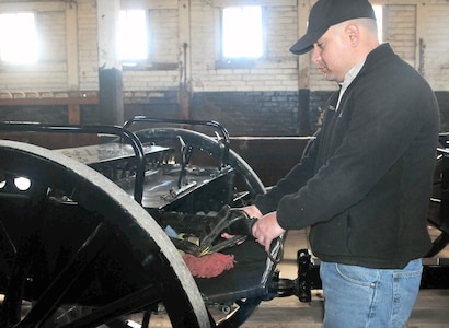 The Fort Sam Houston Caisson Section wagon is cleaned and inspected by Staff Sgt. Samuel Morales, U.S. Army North’s Military Funeral Honors Platoon squad leader at Fort Sam Houston, before being showcased at the Western Heritage Parade and Cattle Drive Saturday.