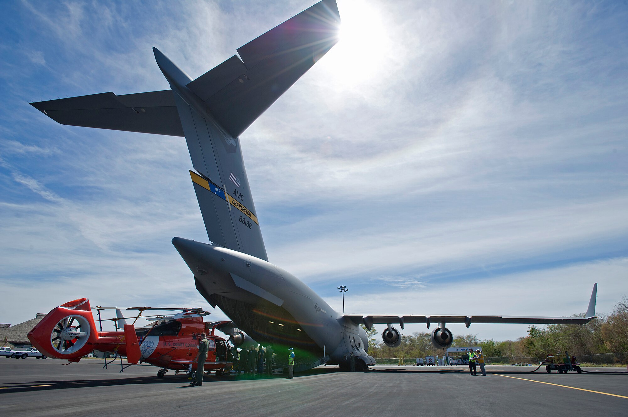 Citizen Airmen assigned to the 300 AS assisted the U.S. Coast Guard with transporting several MH-65 Dolphin helicopters and various supplies Feb. 5-7, 2016. (U.S. Air Force photo by SSgt. Bobby Pilch)