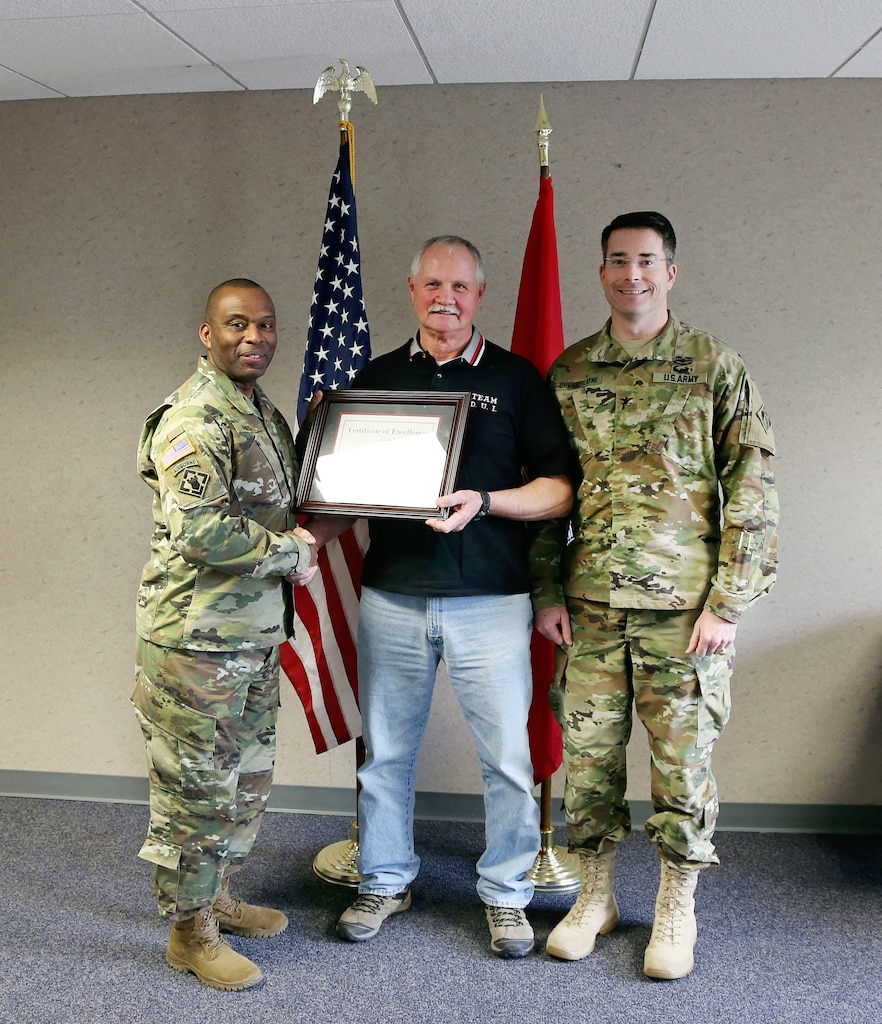 The U.S. Army Corps of Engineers (Corps) Baltimore District commander Col. Edward Chamberlayne (right) and Corps Command Sgt. Major Antonio Jones (left) honored Mr. Walter Beach, seasonal sewage and water plant operator, Tioga-Hammond & Cowanesque Lakes Project, for his heroic actions in preventing loss of life and property damage in a recognition ceremony in Tioga, Pennsylvania, February 8, 2016. 

Beach was praised for taking action in June 2015, when he observed a camper failed to place her vehicle in park while unlatching from her motor home in Tompkins Campground, sending the unattended vehicle on a backwards, downhill descend towards Cowanesque Lake and multiple campsites, restroom facilities, and a playground. Beach quickly drove up the hill and struck the small vehicle with his Army Corps service vehicle, safely bringing it to a stop.  Minimal damage occurred to either vehicle, and there were no bodily injuries. (U.S. Army photo by David Gray)

