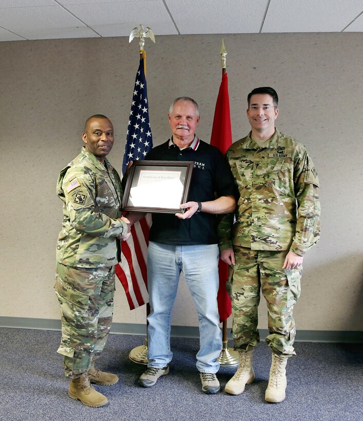 The U.S. Army Corps of Engineers (Corps) Baltimore District commander Col. Edward Chamberlayne (right) and Corps Command Sgt. Major Antonio Jones (left) honored Mr. Walter Beach, seasonal sewage and water plant operator, Tioga-Hammond & Cowanesque Lakes Project, for his heroic actions in preventing loss of life and property damage in a recognition ceremony in Tioga, Pennsylvania, February 8, 2016. 

Beach was praised for taking action in June 2015, when he observed a camper failed to place her vehicle in park while unlatching from her motor home in Tompkins Campground, sending the unattended vehicle on a backwards, downhill descend towards Cowanesque Lake and multiple campsites, restroom facilities, and a playground. Beach quickly drove up the hill and struck the small vehicle with his Army Corps service vehicle, safely bringing it to a stop.  Minimal damage occurred to either vehicle, and there were no bodily injuries. (U.S. Army photo by David Gray)
