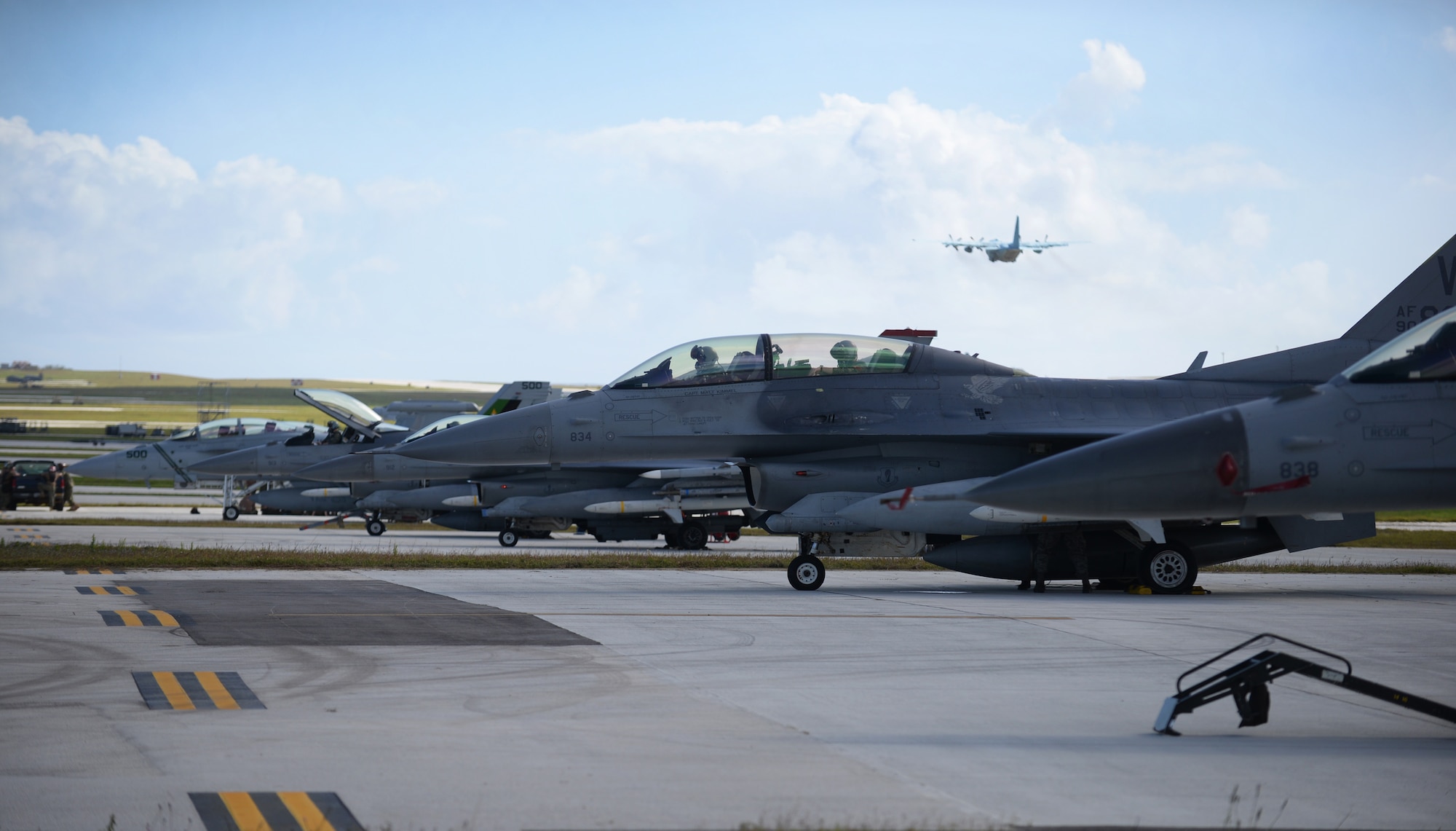 F-16 Fighting Falcons assigned to the 13th Fighter Squadron, Misawa Air Base, Japan, lineup on the flightline in preparation for a mission Feb. 4, 2016, at Andersen Air Force Base, Guam. Several F-16 Fighting Falcons from the 13th FS are deployed to Andersen AFB in support of Cope North 2016. Cope North’s large force employment training with allies strengthens free access to the global commons by enhancing air superiority, interdiction, electronic warfare, tactical airlift and aerial refueling. (U.S. Air Force photo/Senior Airman Joshua Smoot)