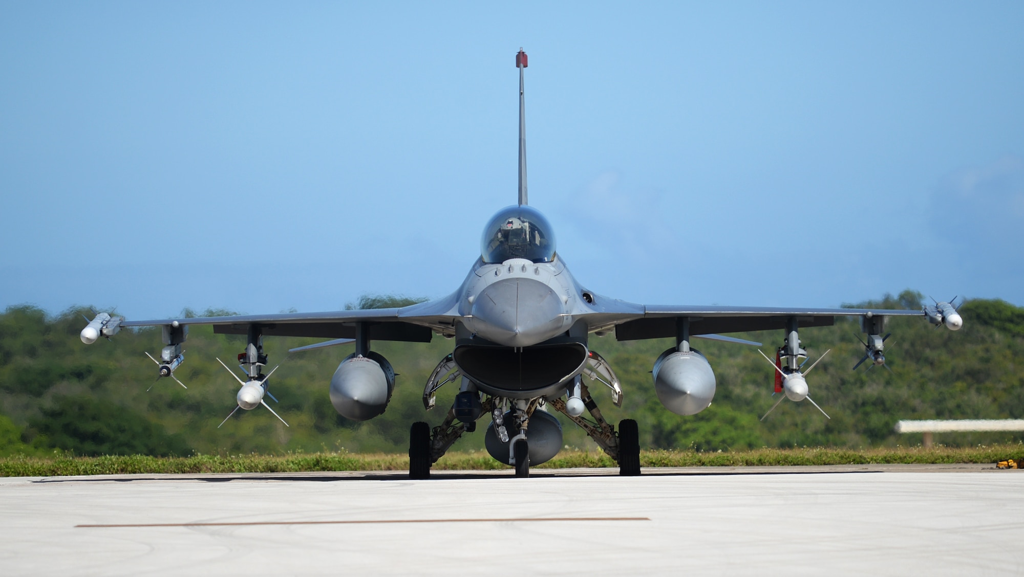 An F-16 Fighting Falcon pilot assigned to the 13th Fighter Squadron, Misawa Air Base, Japan, performs preflight checks Feb. 4, 2016, at Andersen Air Force Base, Guam.  Several F-16 Fighting Falcons from the 13th FS are deployed to Andersen AFB in support of Cope North 2016. Cope North enhances U.S. relations with regional allies and partners by demonstrating the U.S. Air Force’s resolve to promote security and stability throughout the Indo-Asia-Pacific. (U.S. Air Force photo/Senior Airman Joshua Smoot)