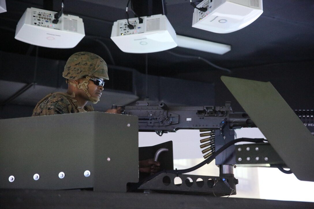 Lance Cpl. Samuel T. Mahaffey, a motor vehicle operator with 8th Engineer Support Battalion, fires a practice M2 .50-caliber machine gun during a convoy operations training simulation at Camp Lejeune, N.C., Feb. 9, 2016. During the simulation, Marines drove through a desert environment, while challenged by an opposing force along the way. (U.S. Marine Corps photo by Cpl. Paul S. Martinez/Released)